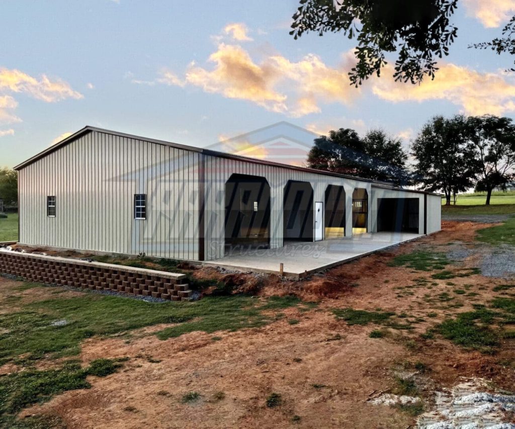A large building with a porch and a garage.