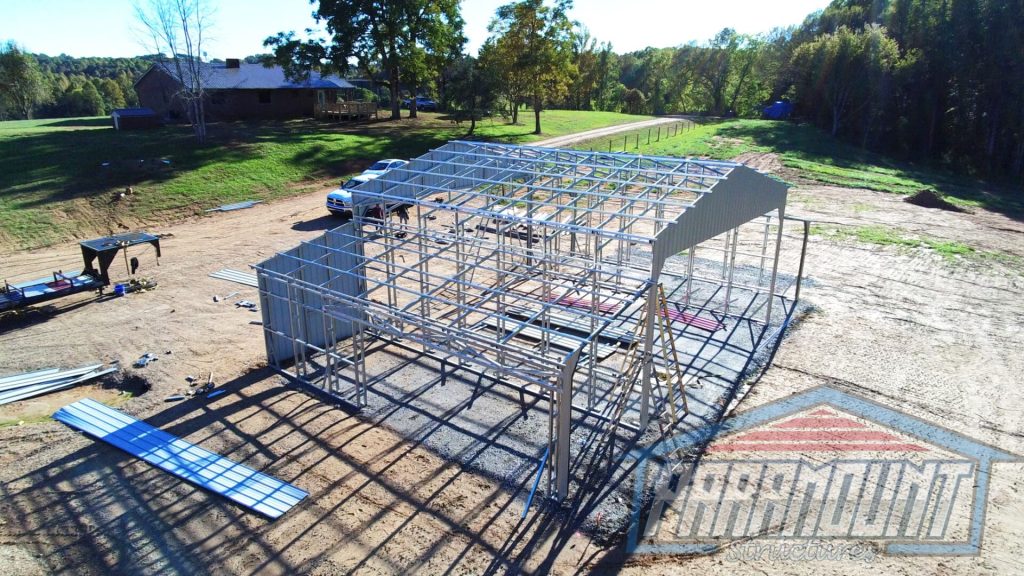 A building being built with metal frame and scaffolding.