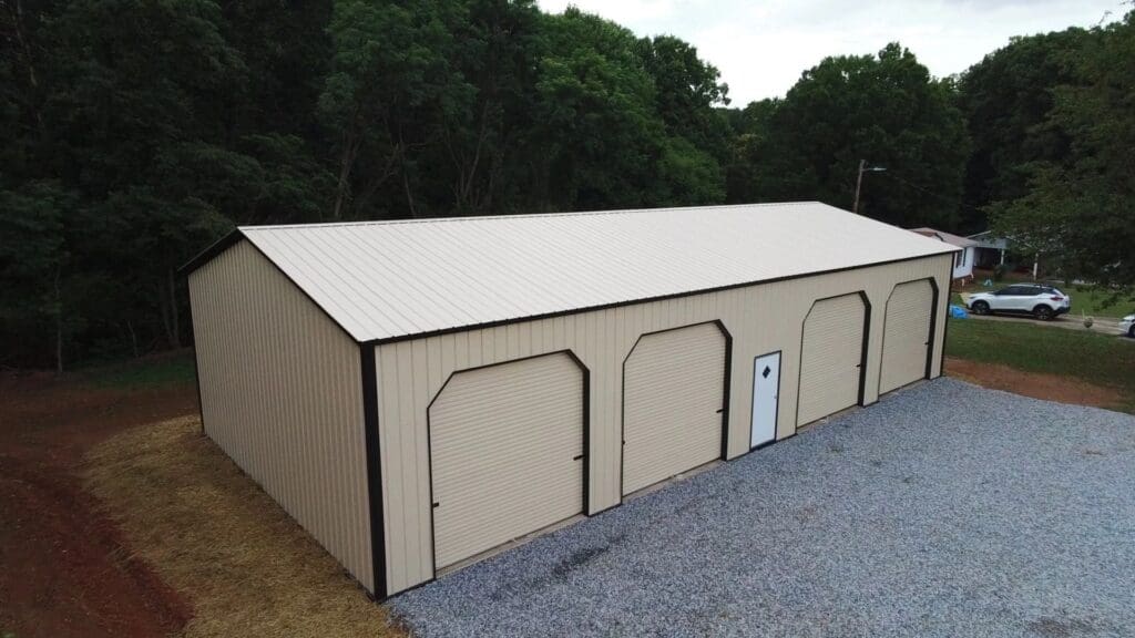 A tan and black garage with three doors.