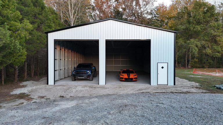 Two cars parked in a white garage.