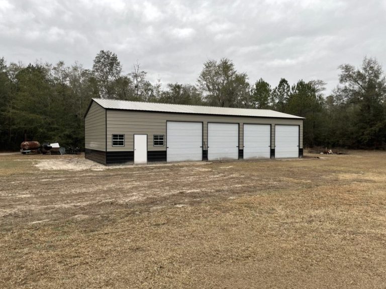 Tan metal garage with four doors.